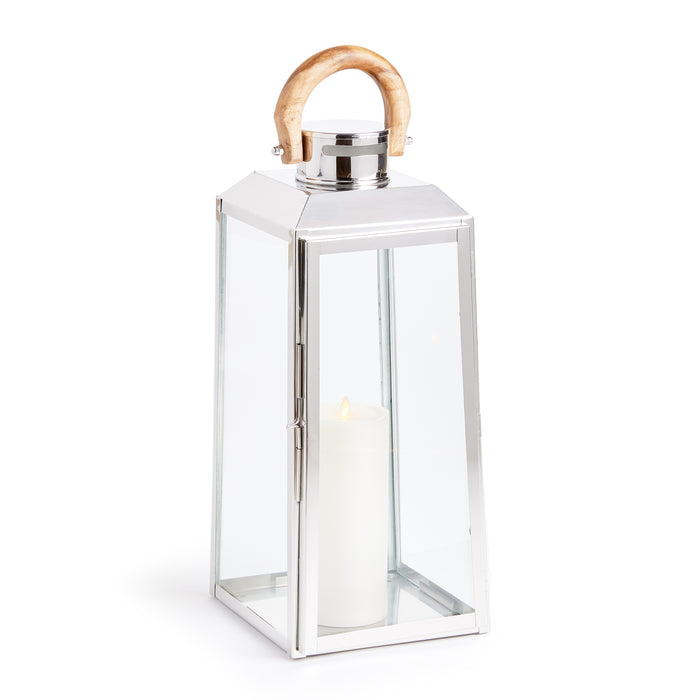 Polished chrome lantern with glass panels, wooden curved handle, candle inside, white background.