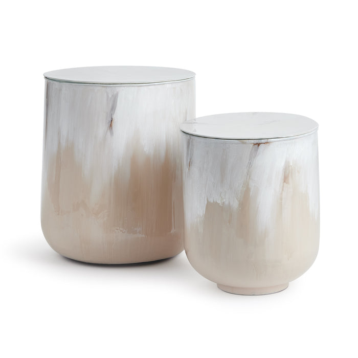 Set of two cylindrical storage tables with white-to-beige painterly glaze, rounded bodies, flat lids, and glass top edge