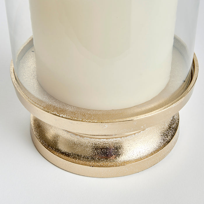 Florence footed hurricane candle holder with glass cylinder and gold-tone base on white background