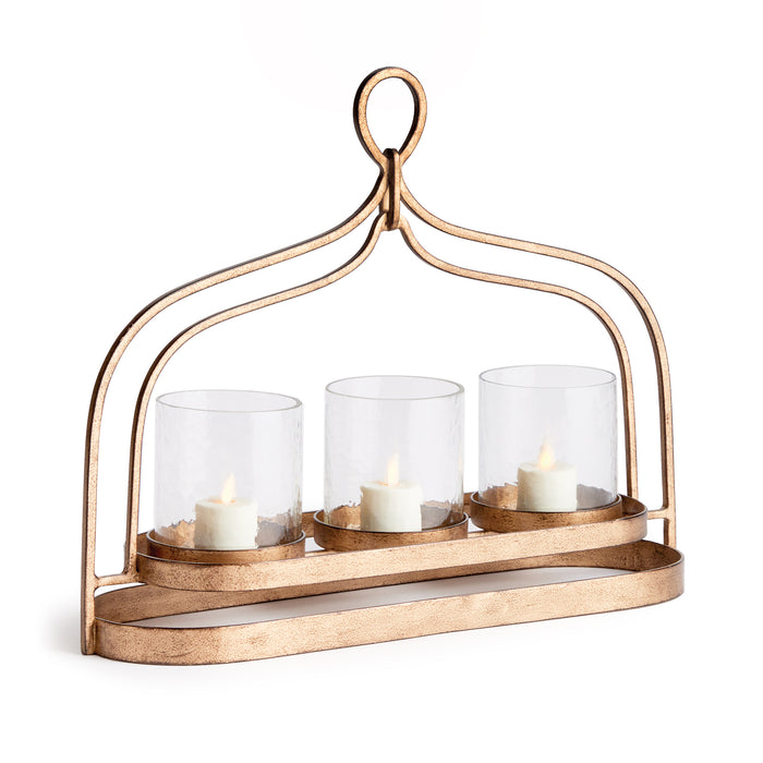 A bronze-colored aluminum hurricane-style candle holder with a decorative loop handle at the top, featuring three clear glass candle holders.