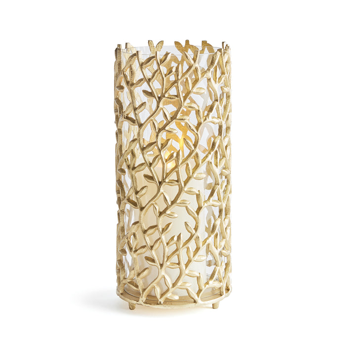A hurricane candle holder with a glass vessel and whimsical flowing vines made of aluminum.