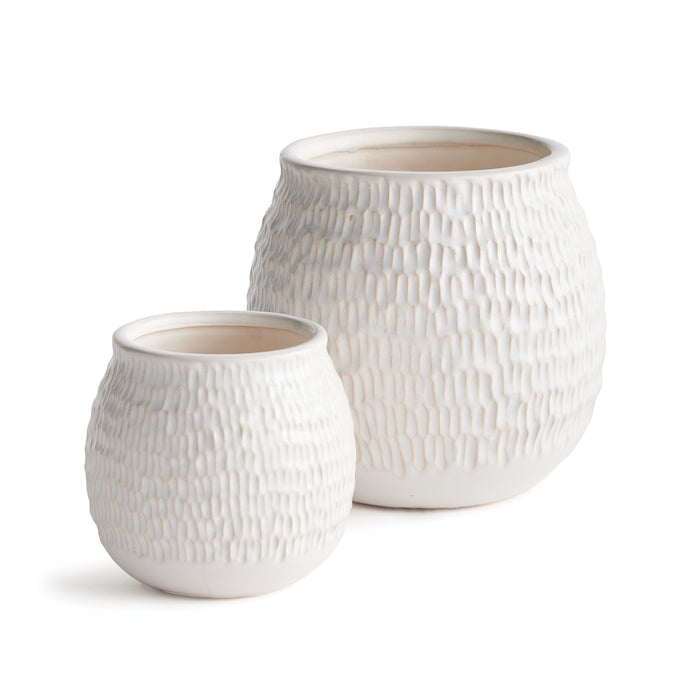 Pair of cream textured ceramic pots with a bubbly, honeycomb-like surface and smooth rims on a white background.