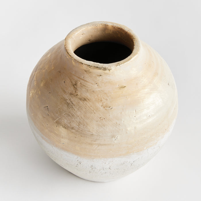 Small teardrop vase with a round, bulbous body, beige and off-white glazed surface, rough texture and a wide open neck; sits
