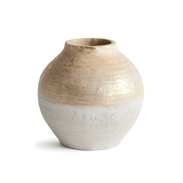 Small teardrop ceramic vase with a beige glossy upper glaze and rough white lower half on a white background.