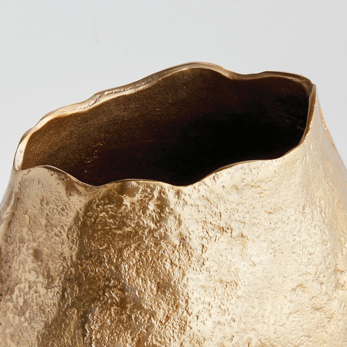 Gold-toned vase with a textured, irregular surface and a dark bronze, wavy rim inside. Background is pale.