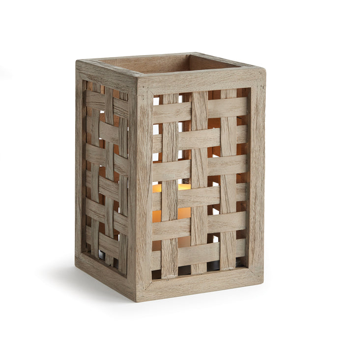 Weathered wood lantern with a woven panel design, square frame, warm candle glow visible through gaps, rustic outdoor style.
