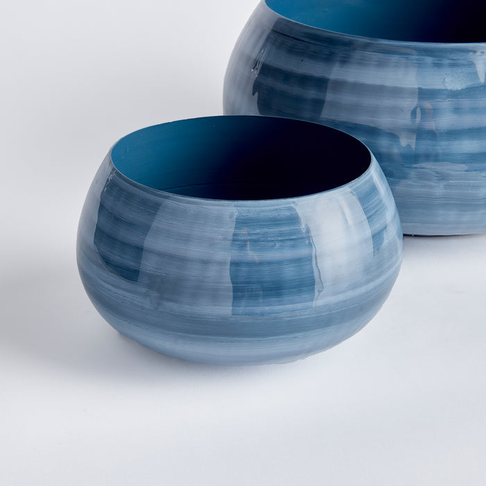 Set of 2 blue ceramic bowls with glossy, variegated glaze; round, wide-mouthed, deep cobalt interiors on a light background.