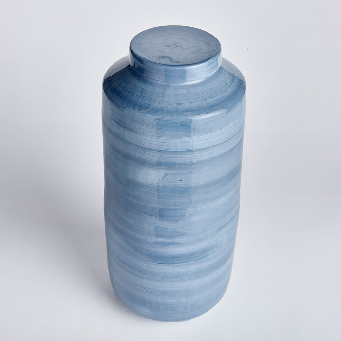 Large blue ceramic ginger jar with light blue glaze and horizontal banded brush strokes on a white background.