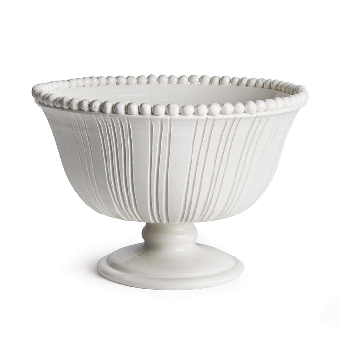 White ceramic footed bowl with vertical fluted lines, beaded rim, and pedestal base.
