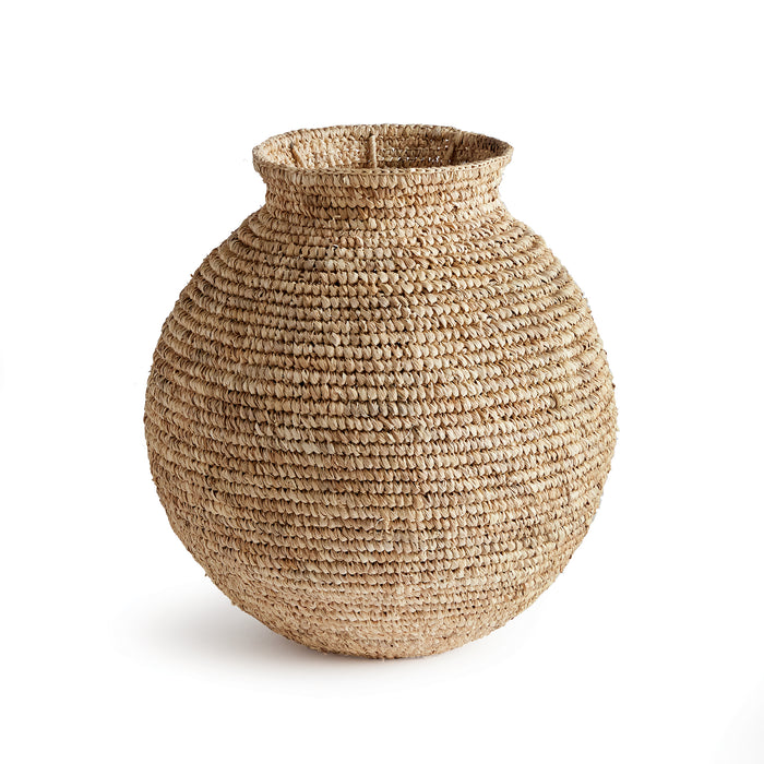 A small woven vase made of natural corn husk material, with a tightly structured geometric pattern.