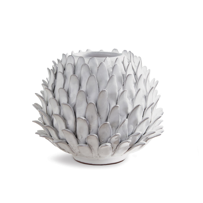 Small ceramic vase with layered white, petal-like scales forming a rounded, artichoke-inspired texture on a flat base.