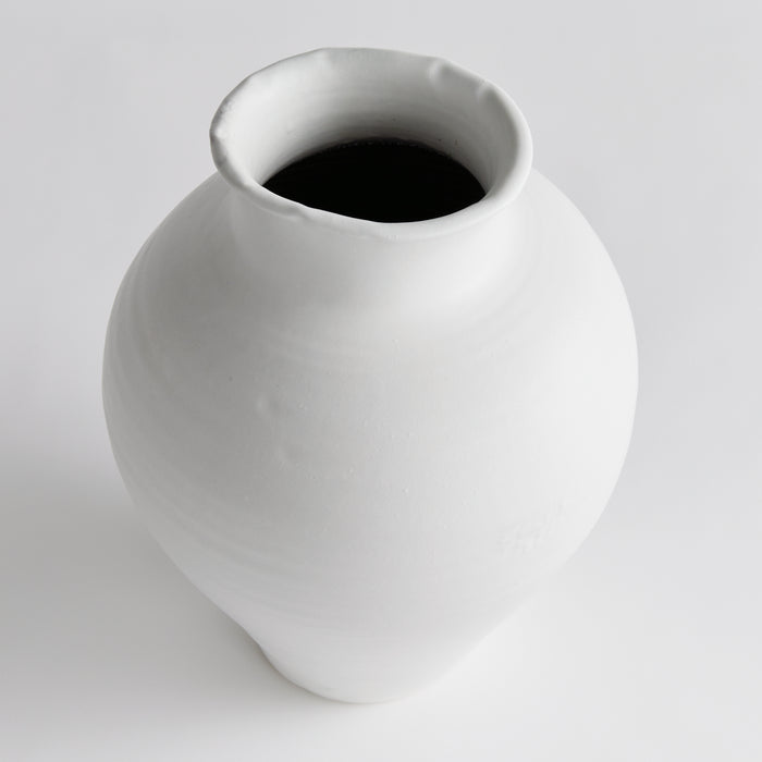 Large white ceramic vase with a rounded body and narrow lip opening.