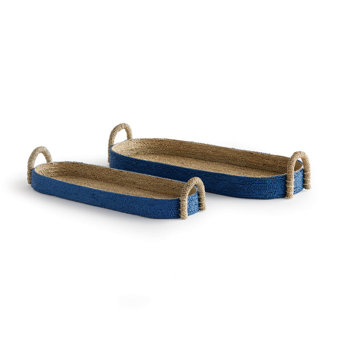 A pair of oval-shaped baskets with a seagrass weave and indigo-colored plywood frames, with no visible handles or legs.