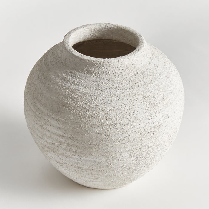 Large spherical off-white vase with rough, textured surface and a wide top opening, neutral background.