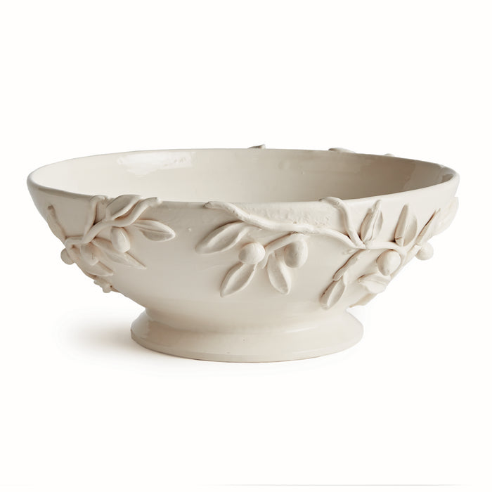 Cream ceramic footed bowl with raised olive branch and berry motif along exterior, glossy glaze, white background.