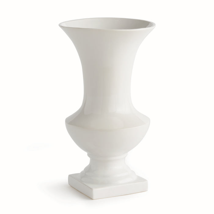 White ceramic footed vase with a tall, flared opening and a bulbous midsection on a square pedestal base.