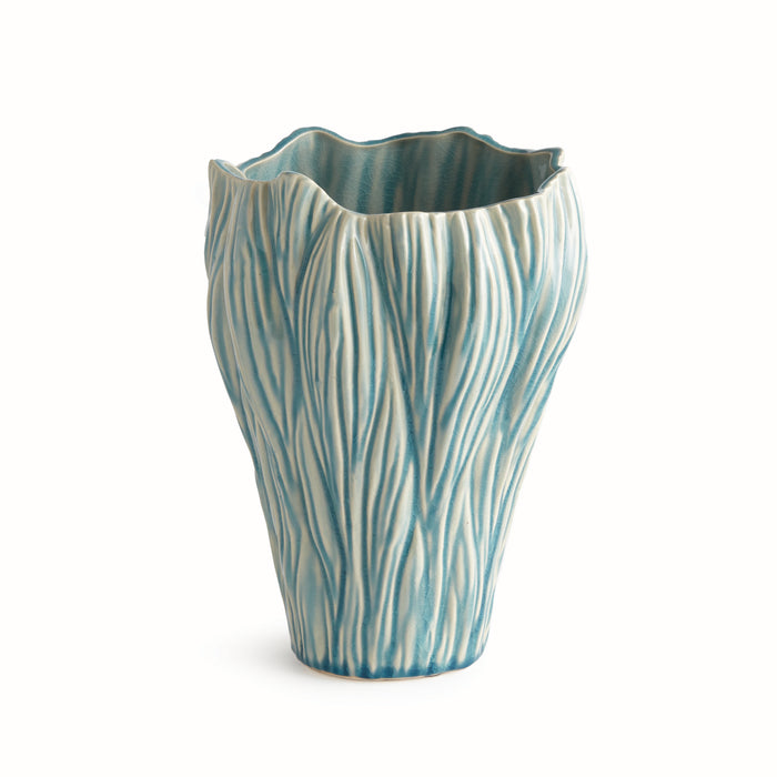 Small vase with blue-turred glaze and white streaks, textured ribbed exterior, wave-like rim, on white background.
