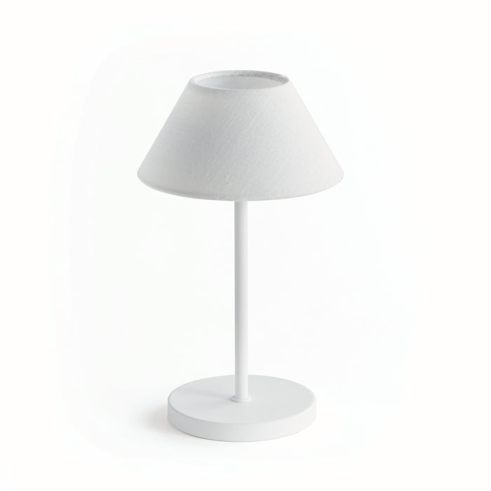 A white cordless LED lamp with an empire linen shade, featuring a simple round base and a single button on top for operation.