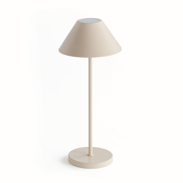 A cordless LED lamp with an empire linen shade, standing on a circular base, in a neutral color.