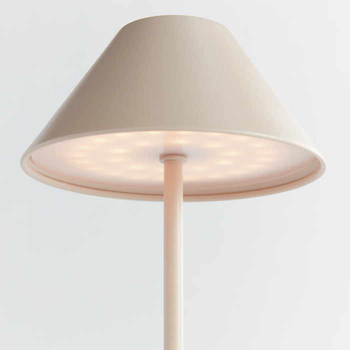 Beige cordless LED lamp with conical fabric shade, round base illuminated, slender pole, soft ambient light, plain