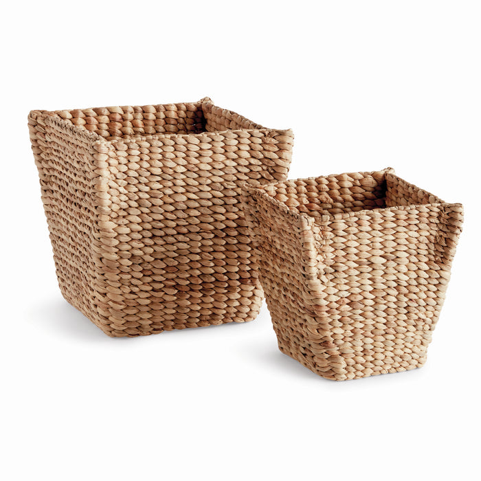 Two square tapered brown wicker baskets with a natural texture and no visible handles or lids.