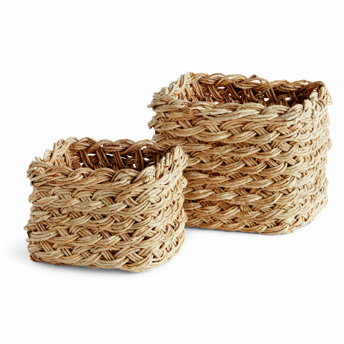 Two square wicker storage baskets with French braid design, in varying shades of brown and beige.