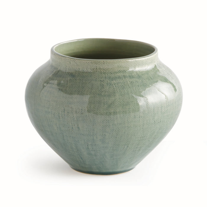 Round ceramic vase with glossy sage glaze, bulbous body, narrow neck, subtle crackle texture on pale green background.