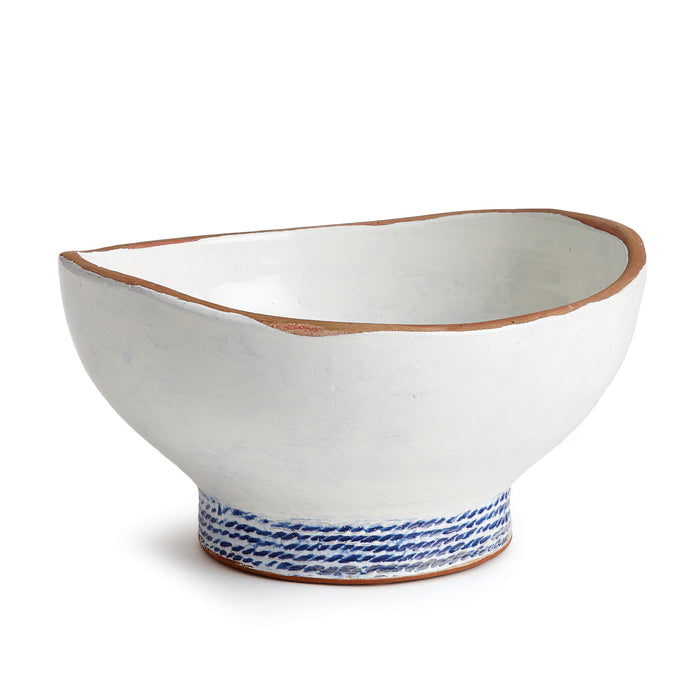 White ceramic bowl with a blue braided base pattern and an irregular rim, open top, pale interior.