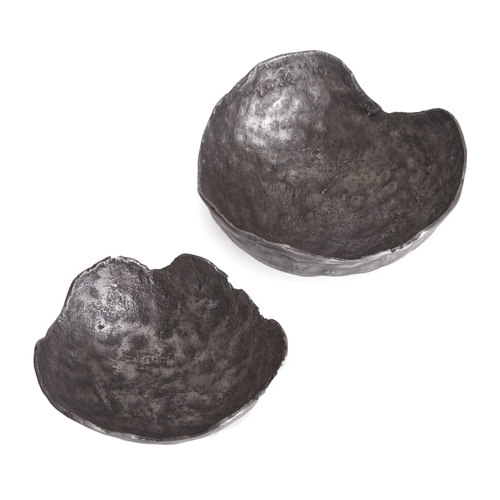 Two dark gray textured decorative bowls, imperfect round shapes, set against a white background.