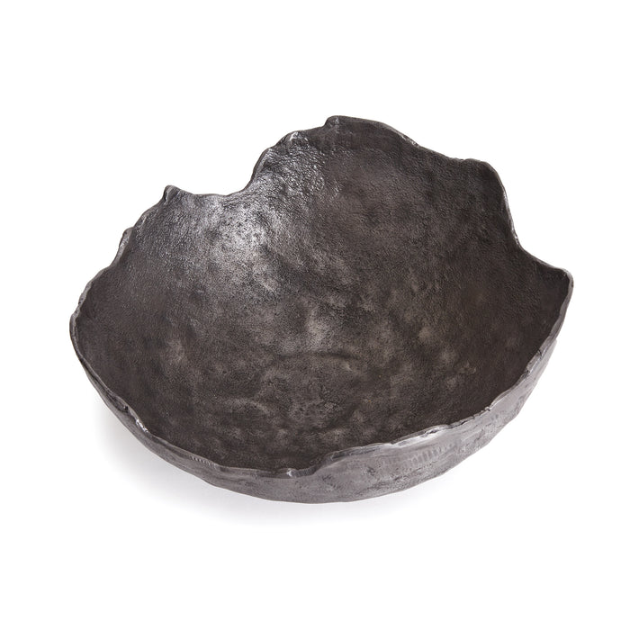 Dark, irregular bowl with a rough, matte black finish and uneven, natural edges on a white background.