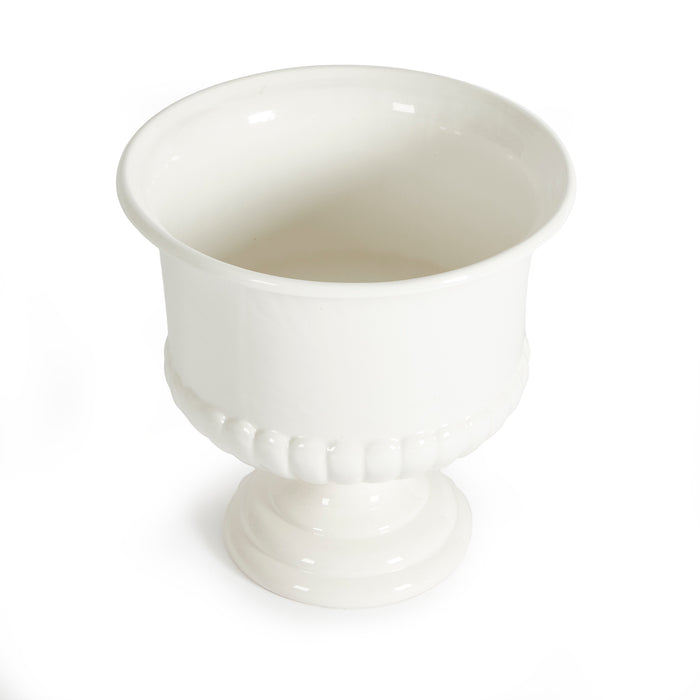 White ceramic pedestal bowl with a fluted base and smooth curved rim, plain glossy finish, on white background.