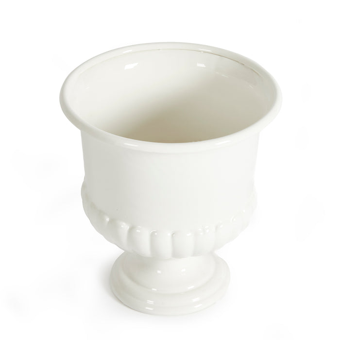 Small white decorative pedestal bowl with a fluted base and glossy ceramic finish on a plain white background.
