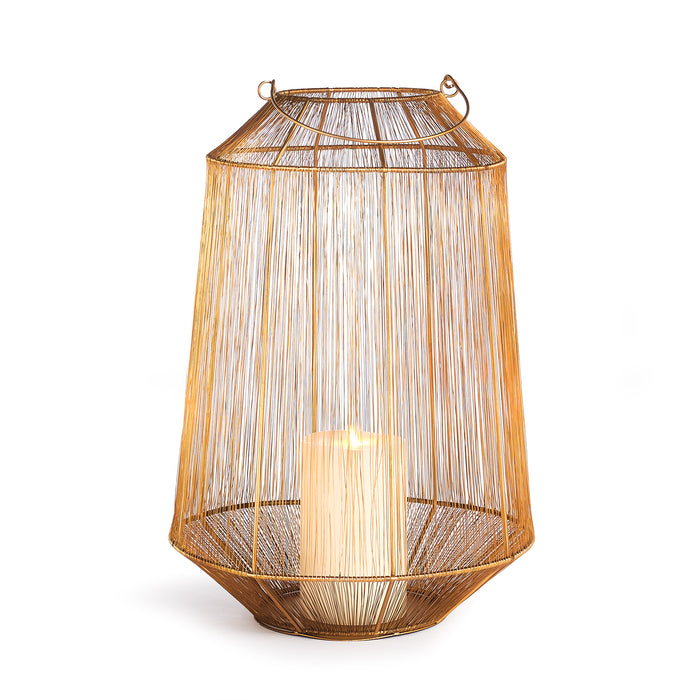 A golden metallic lantern-shaped candle holder with a solid iron frame and open spaces allowing candlelight to shine through.