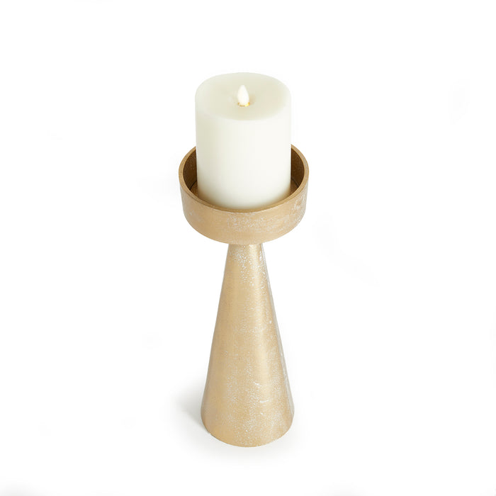 Beige tapered metal candle holder with a circular top ring holding a white pillar candle, set against a white background.
