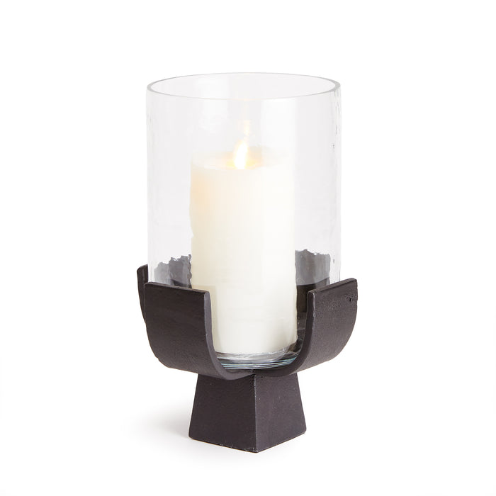 A bronze modern candle holder with a glass cylinder and hammered glass texture, designed to support a candle for a warm glow.