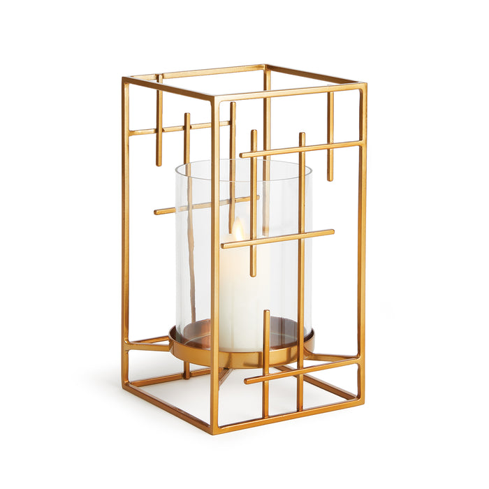 A geometric-style gold and iron hurricane candle holder with a clear glass container.