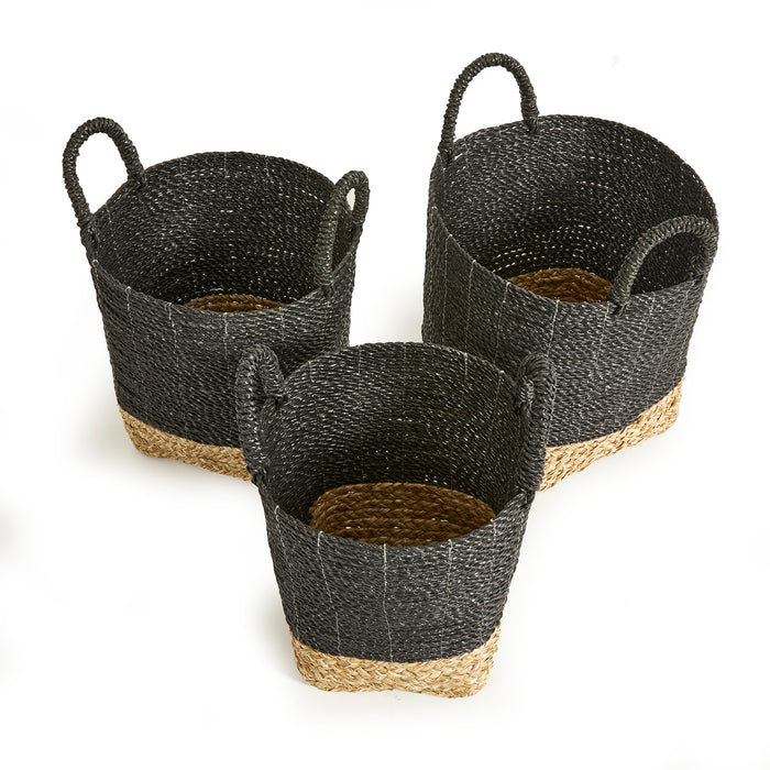 Set of three dark woven baskets with black body and natural tan jute base, rounded handles, on white background.
