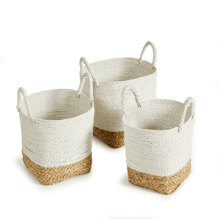 Set of three woven baskets with white upper portion and natural tan bottom, rounded sides and short rope handles.