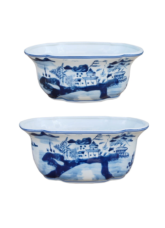 Two oval-shaped porcelain planters with a black and white authentic Canton design.