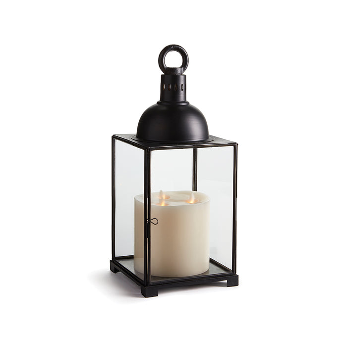 A black iron lantern with a glass base and a candle inside, featuring a black lid on top.