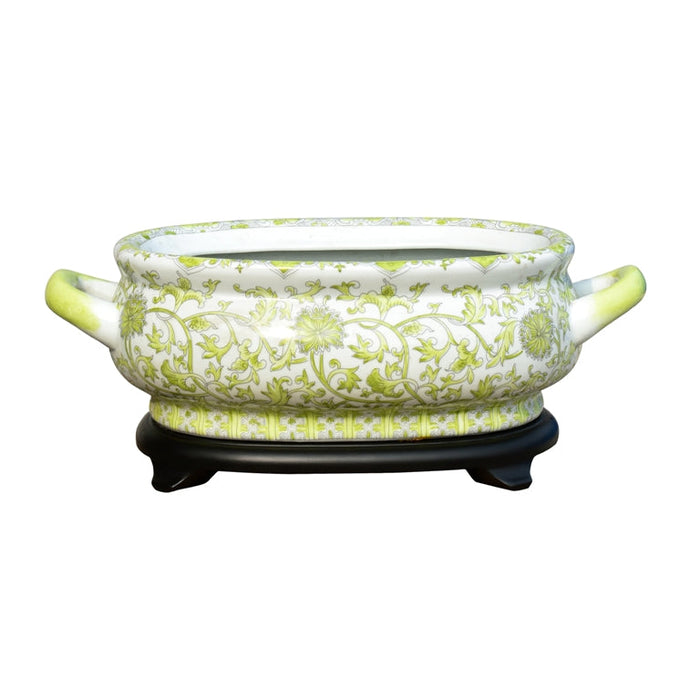 Ceramic pot with green floral pattern on a white background