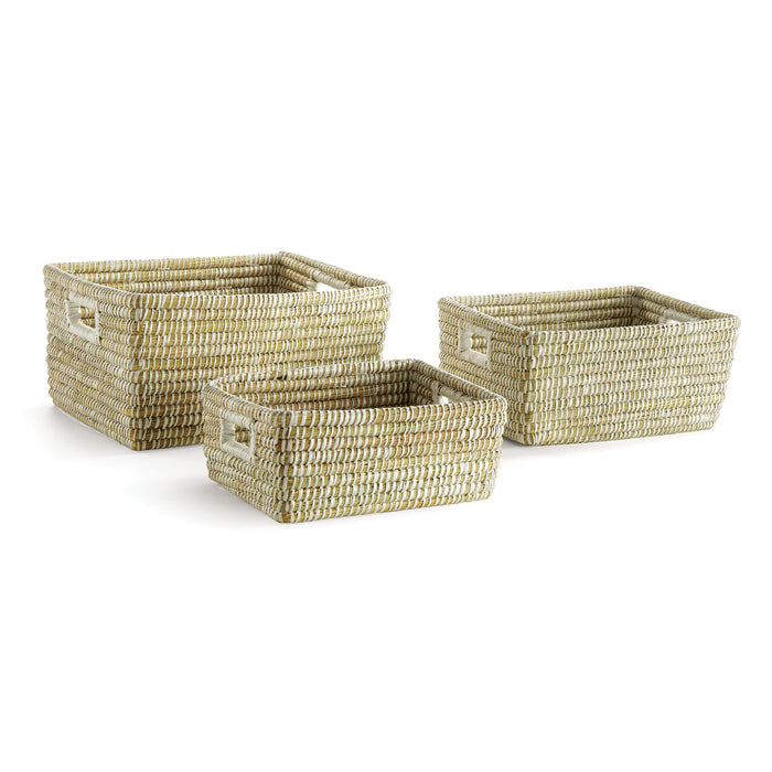 A set of three rectangular wicker storage baskets in a natural beige color.