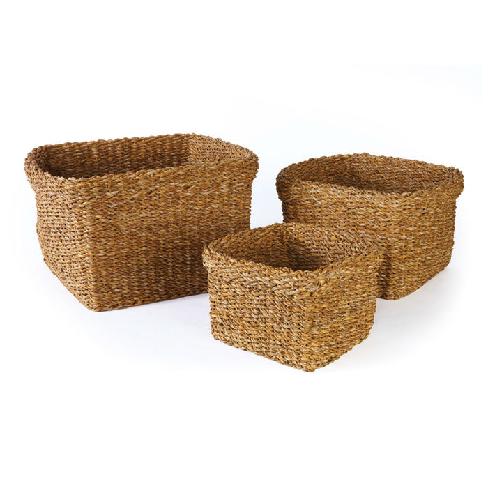 A set of three square seagrass baskets with cuffs.