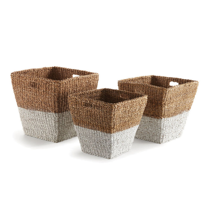 Three rectangular seagrass storage baskets with a two-toned design, featuring a natural brown color on the outside and a lighter color on the inside.