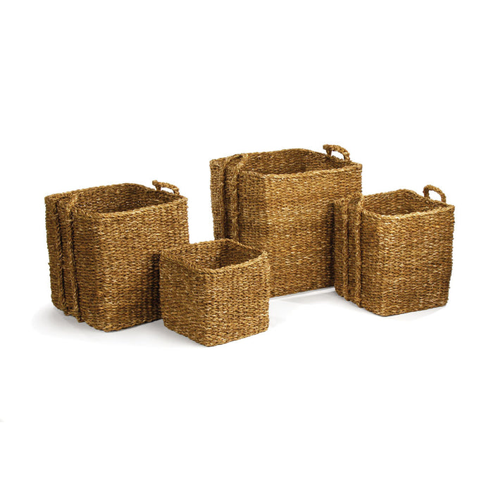 A set of three seagrass apple baskets in different sizes with handles on the sides.
