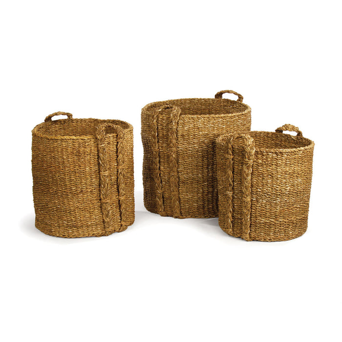 Three round seagrass laundry baskets in different sizes with handles, set on a white background.