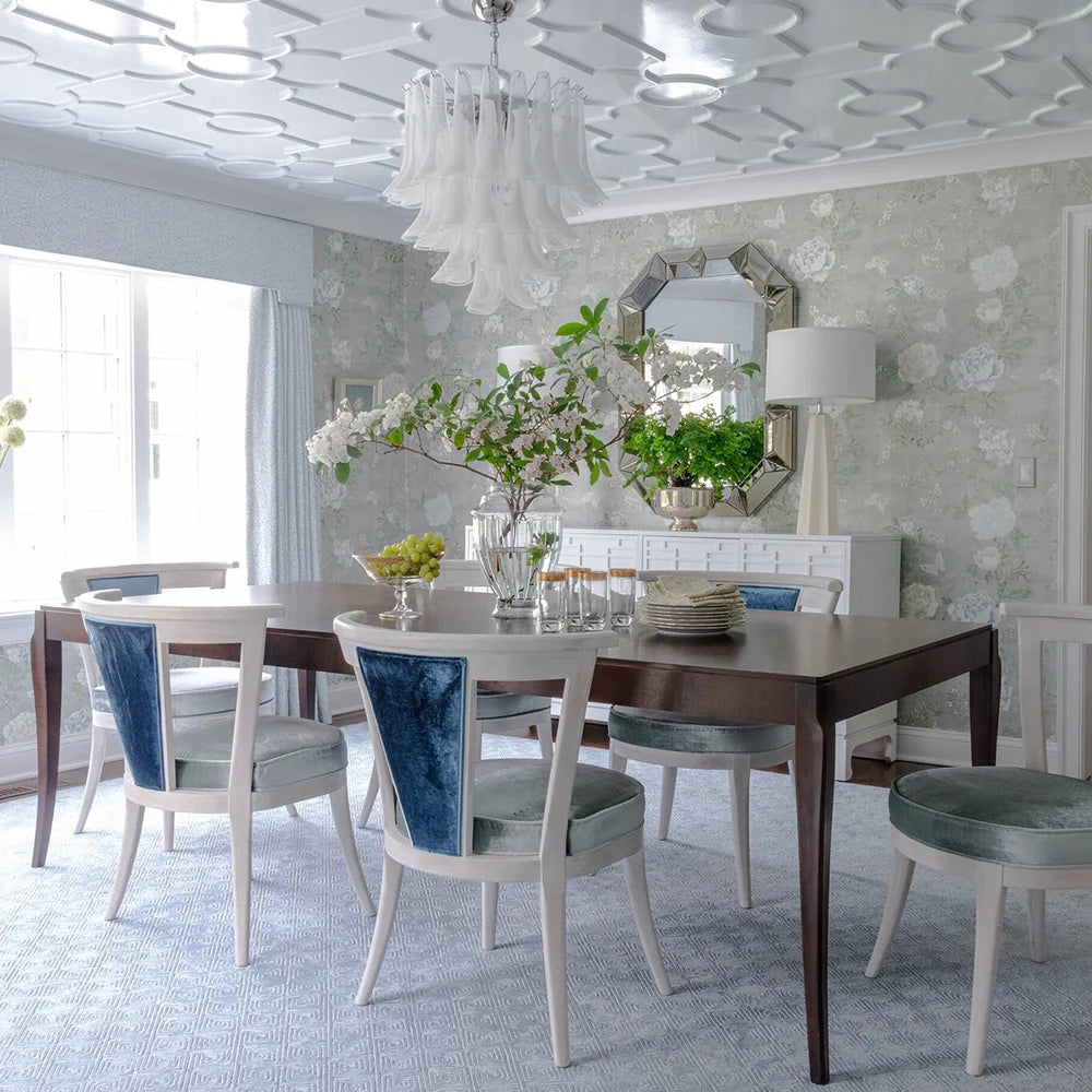 Dining room with a table, chairs, and decorative elements.