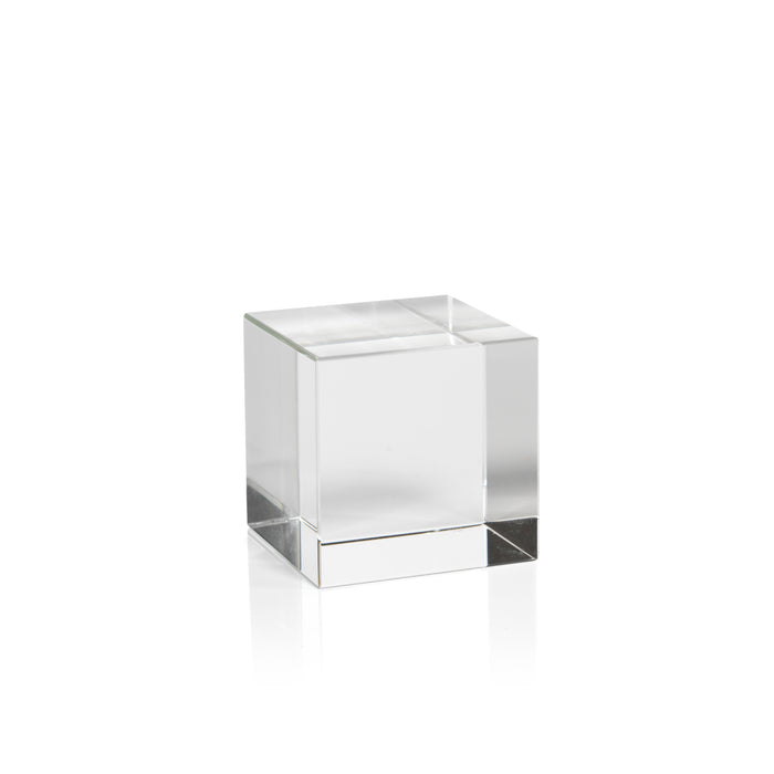 Set of two clear crystal glass cubes with polished edges on a white background.