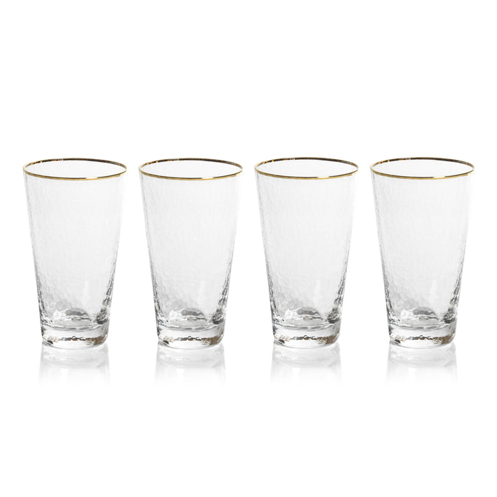 A set of four clear highball glasses with gold-colored rims, displayed side by side against a white background.