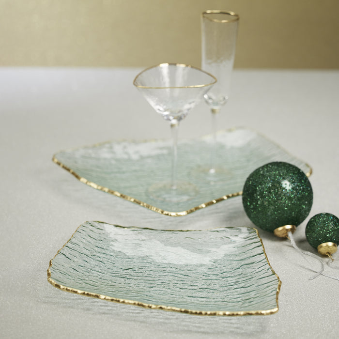 Set of four rectangular organic plates with jagged gold rims, pale green textured surfaces, and gold-edged edges, paired